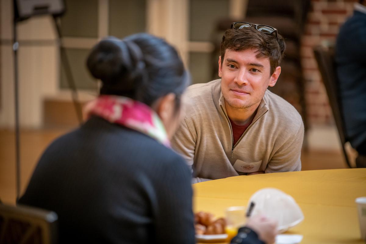 Prospective Student aat a table asking questions